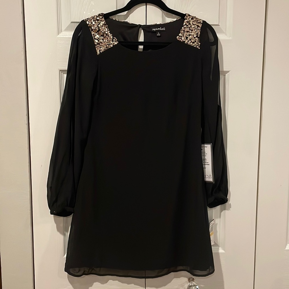 NWT. Sequin Hearts Black Dress w/ open arms and sequin on shoulders. Size Small.